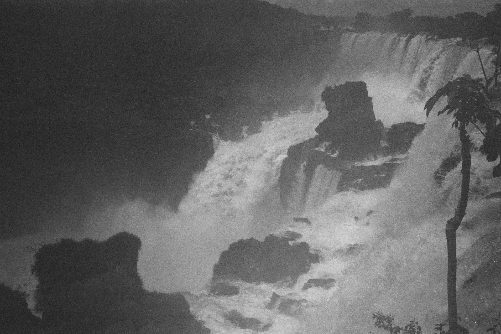 Black-and-white photograph of clouds and a mountain ridge